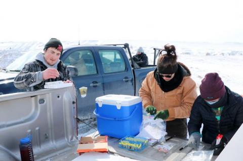 Dept. of Natural Resource Management graduate student Austin Wieseler, left, organizes blood serum samples as part of disease-testing Badlands bighorn sheep through a grant from the National Park Service. He is working with Mandy Ensurd, a South Dakota Game Fish and Parks Wildlife Technician, and SDSU graduate student Samantha Fino.