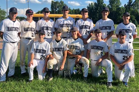 The Hartington Juniors pose with the Creighton Wooden Bat Tournament plaque after defeating O'Neill and Creighton on Saturday to win the tournament. Photo Credit Lori Bengston