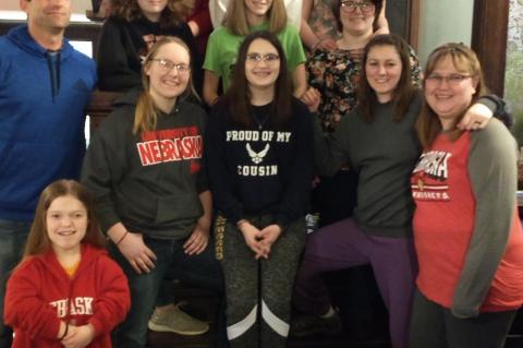 Members of the Rock County Speech Team pose on the staircase at the Historic Hartington Hotel. They are: Bottom left: Hannah Keller, Bottom right: Kristy Beard(Assistant Speech Coach), First row: Justin Teel(bus driver), Jaya Nelson, Kylie Beard, Rachel Usasz-Keber(Head Speech Coach), Second Row: Sailor Jewett, Jillian Buell, Suzi Smiley, Third Row: Adam Turpin, Taylor Fales, Brandie Messersmith, Fourth Row: Alex Chavez, Carson Shaw  Not pictured parents: Penni Shaw and Kerry Keller