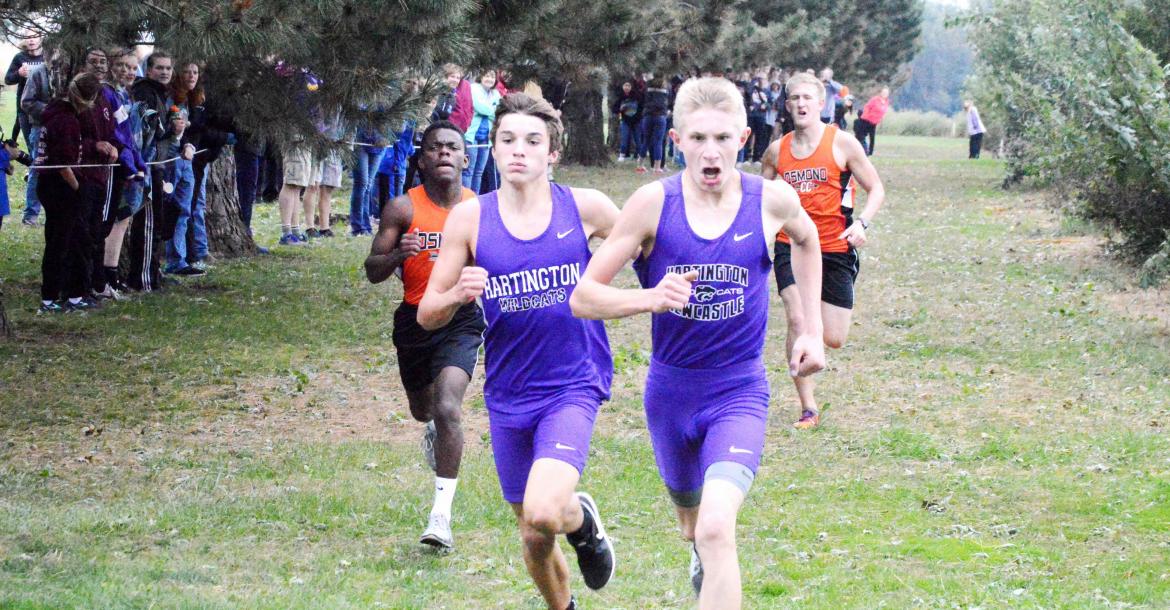 Hartington-Newcastle's Brayden Kathol and Dagen Joachimsen edge out Osmond's Johnson Chishiba and Jared Bessmer for first and second place at the close of Friday's Lewis and Clark Conference meet