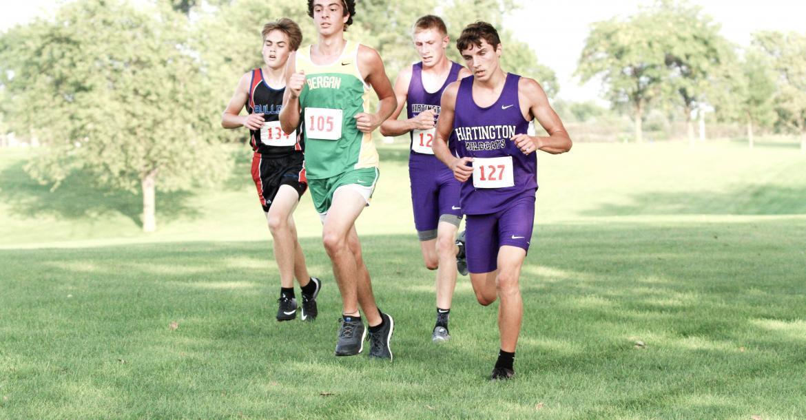 Hartington-Newcastle's Dagen Joachimsen (127) runs in a group of runners that includes Brayden Kathol (over Joachimsen's shoulder) in the final 1,000-meter stretch at Thursday's Wisner-Pilger Invitational. The Wildcat boys edged BRLD by six points to claim the title.