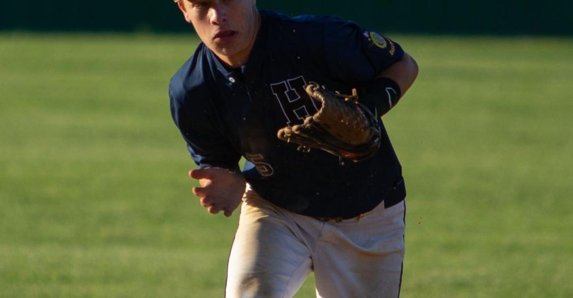 Brady Steffen fumbles a grounder during a Sr. Legion game against Neligh