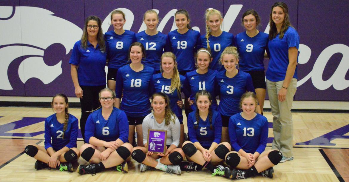 The Wynot volleyball team poses with the championship plaque